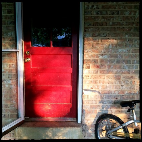 red back door with bike